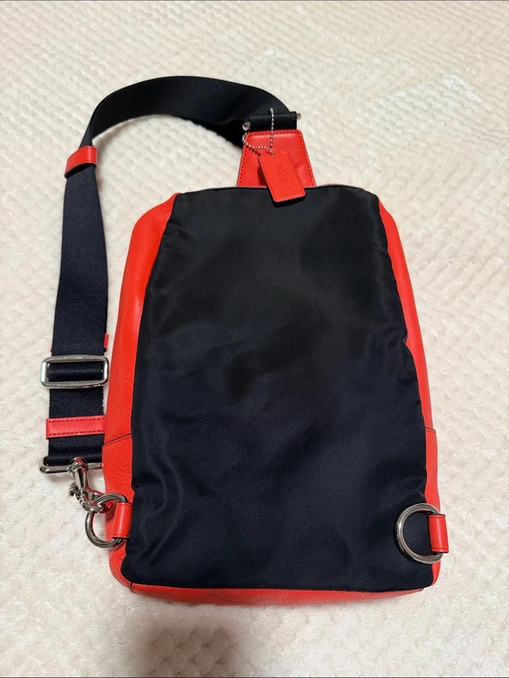 NWT Coach Orange Pebble Leather Crossbody Sling with Black Strap